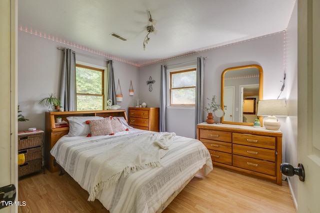 bedroom featuring light hardwood / wood-style floors