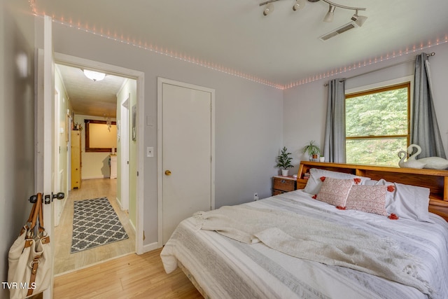 bedroom featuring light hardwood / wood-style floors