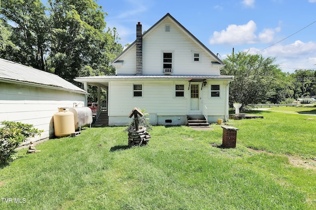 back of house with a yard