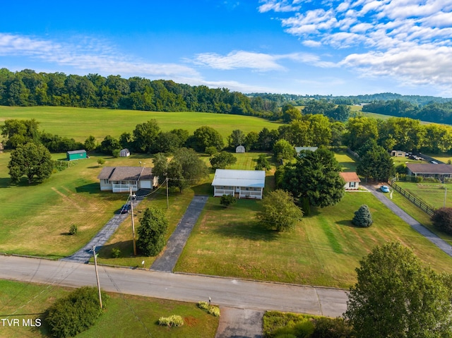 birds eye view of property with a rural view