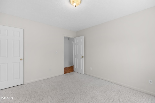 unfurnished bedroom featuring carpet flooring