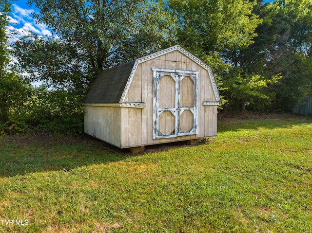 view of outdoor structure with a lawn