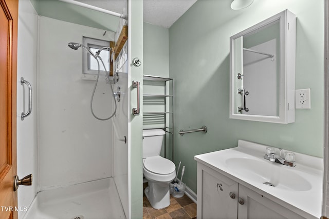 bathroom featuring a textured ceiling, a shower, toilet, tile patterned floors, and vanity