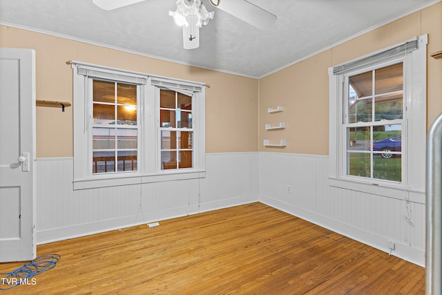 spare room with ceiling fan and hardwood / wood-style flooring