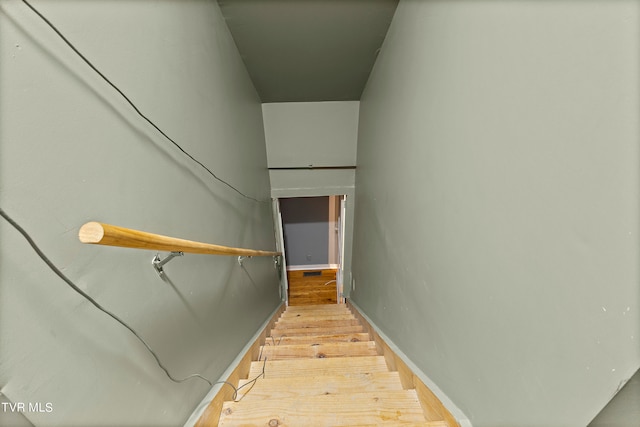 staircase with light hardwood / wood-style flooring