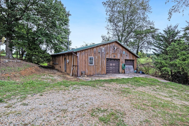 view of outdoor structure with a garage