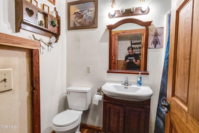 bathroom with vanity and toilet