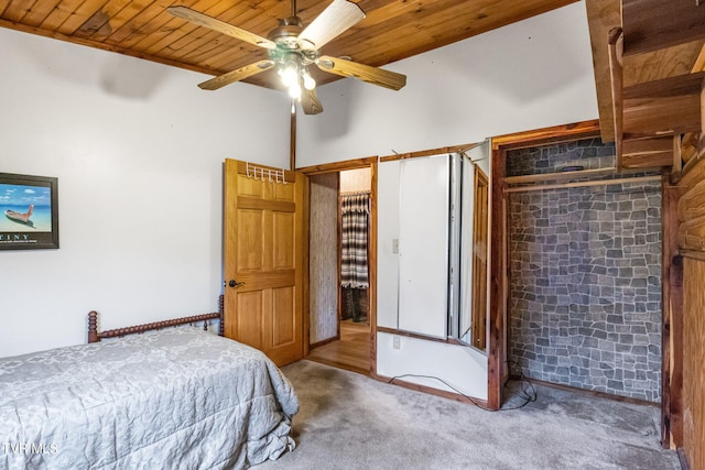 bedroom with wooden ceiling, carpet, and ceiling fan