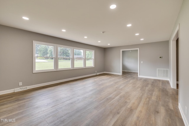 unfurnished room with light hardwood / wood-style flooring