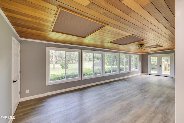 spare room with ceiling fan, wooden ceiling, hardwood / wood-style floors, and french doors