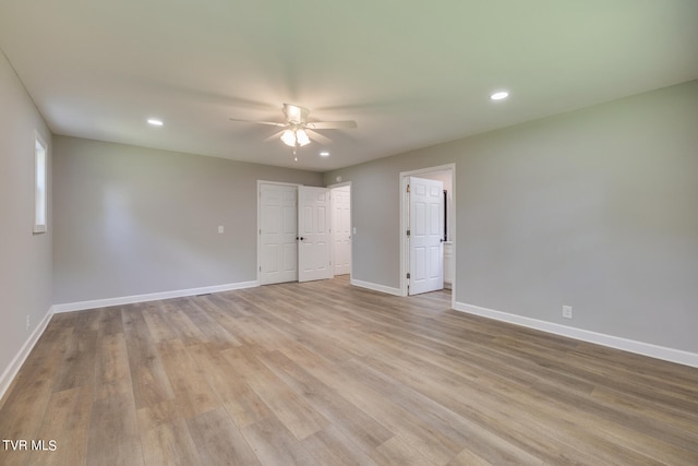 unfurnished bedroom with light wood-type flooring and ceiling fan