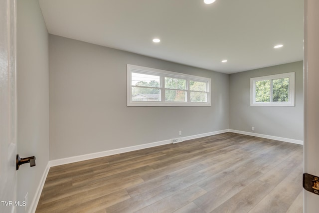 unfurnished room featuring hardwood / wood-style flooring