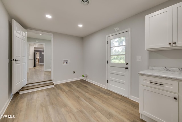 doorway to outside featuring light wood-type flooring