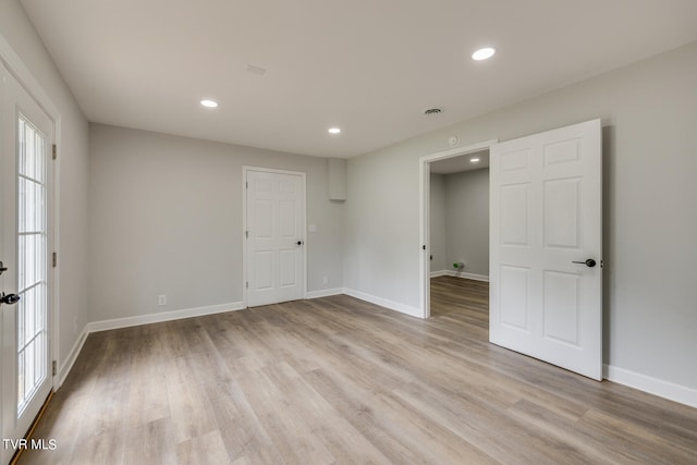 interior space with light hardwood / wood-style flooring and plenty of natural light