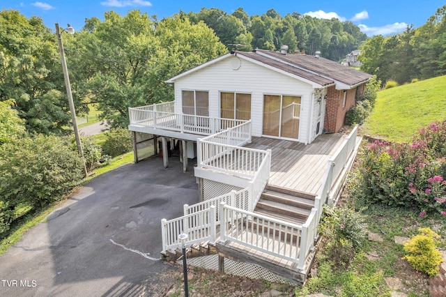 view of front of home featuring a wooden deck and a carport