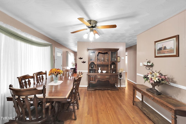 dining area featuring ceiling fan and hardwood / wood-style flooring