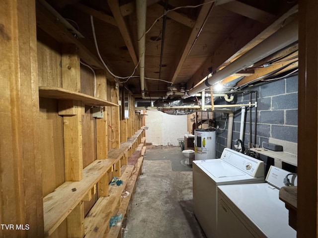 basement featuring water heater and washer and dryer