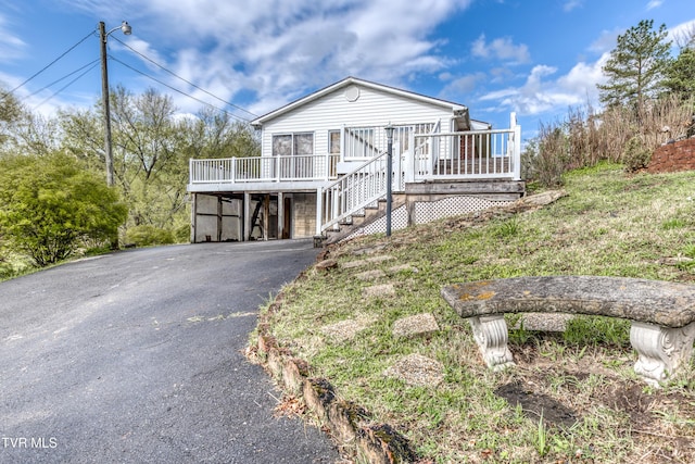 172 Lee Ave, Lebanon, VA 24266 - view of front of home with aphalt driveway, a deck, and stairway
