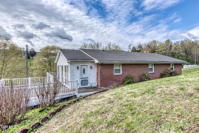 172 Lee Ave, Lebanon, VA 24266 - exterior space featuring brick siding and a front lawn
