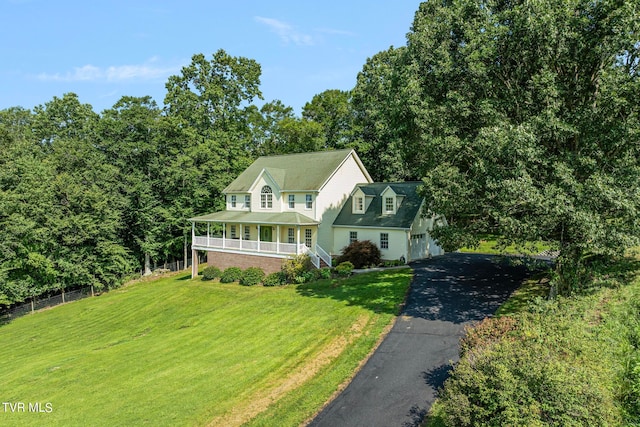 view of front of home featuring a front lawn and a porch