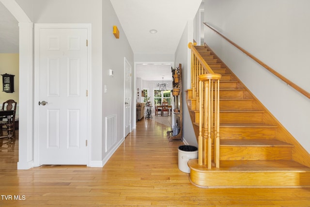 stairway featuring wood-type flooring