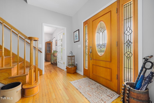 foyer with light hardwood / wood-style flooring and a wealth of natural light