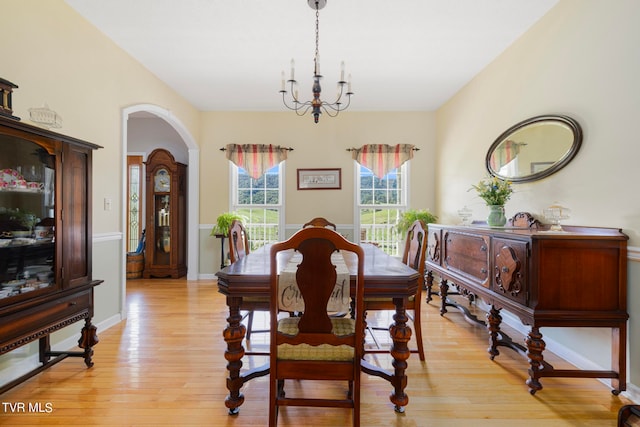 dining room featuring a chandelier and light hardwood / wood-style floors