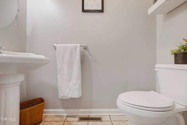 bathroom featuring toilet and tile patterned floors