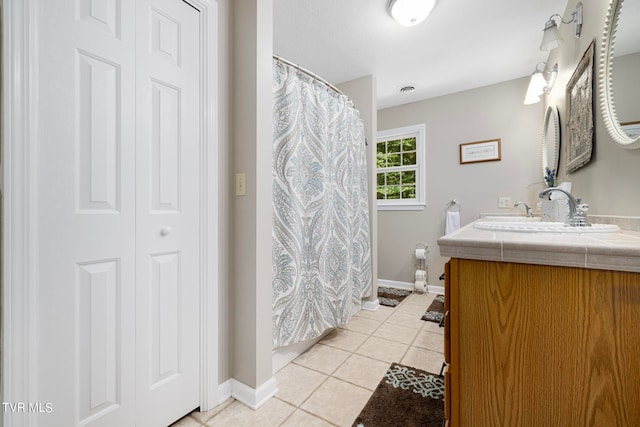 bathroom featuring vanity and tile patterned flooring