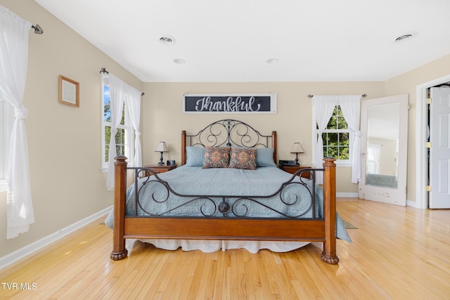 bedroom with light hardwood / wood-style floors