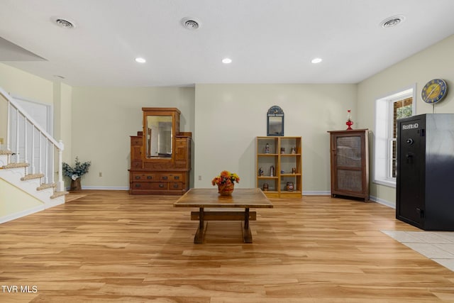 living room with light hardwood / wood-style flooring