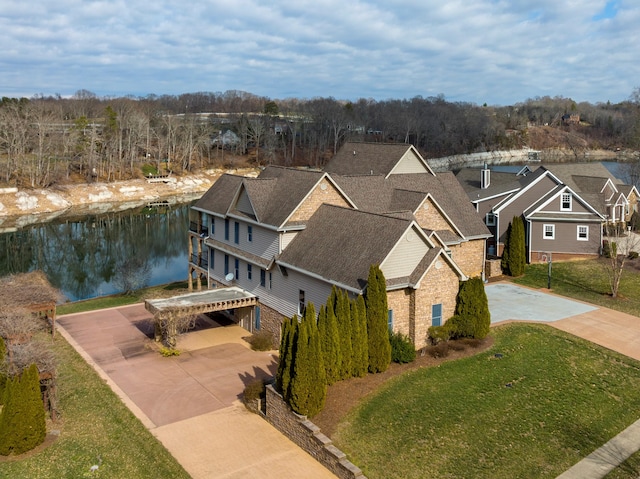 birds eye view of property with a water view