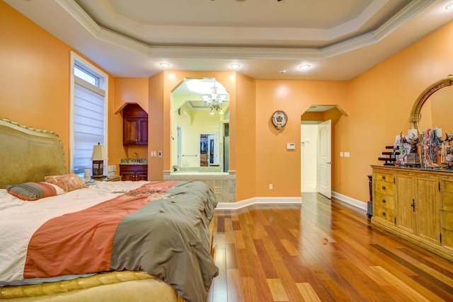 450 Lake Approach, Johnson City, TN 37601 - bedroom featuring crown molding, a chandelier, wood finished floors, arched walkways, and a raised ceiling