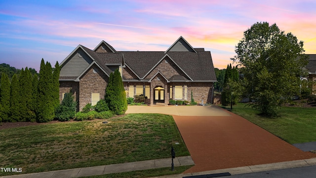 view of front of home with a yard