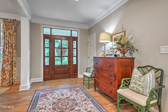 entryway featuring crown molding and light hardwood / wood-style flooring