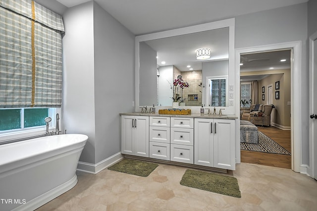 bathroom featuring vanity and plus walk in shower