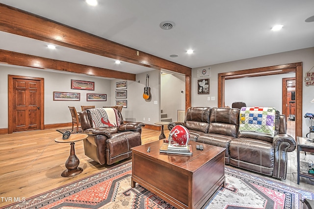 living room with hardwood / wood-style flooring and beamed ceiling