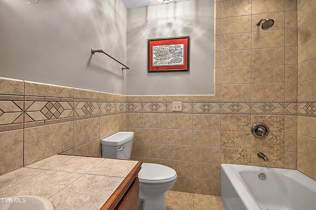 full bathroom with toilet, shower / bathing tub combination, tile walls, vanity, and tile patterned flooring