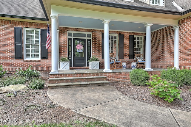 property entrance featuring a porch