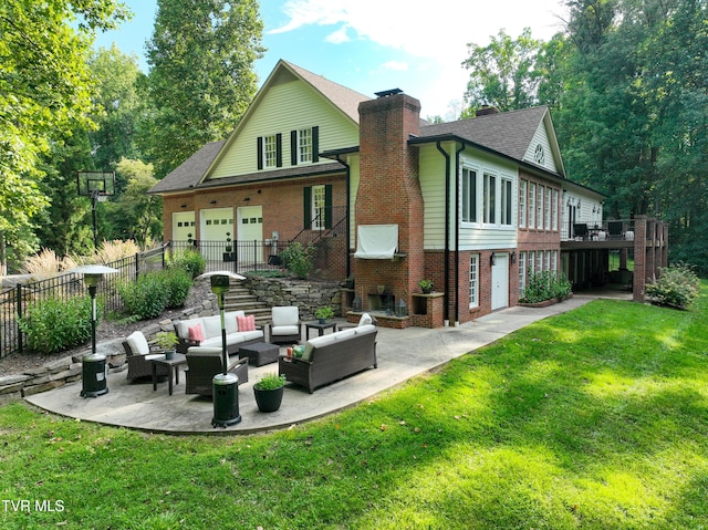 rear view of property featuring a yard, an outdoor living space, and a patio