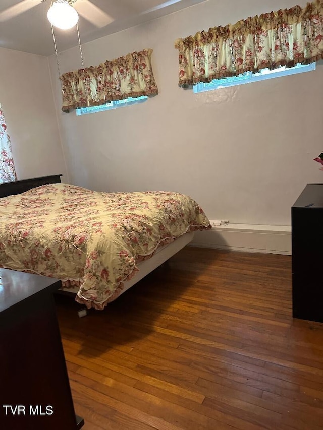 bedroom featuring ceiling fan and hardwood / wood-style floors