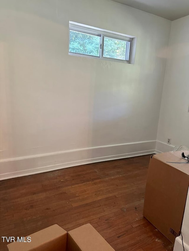 spare room featuring dark hardwood / wood-style floors