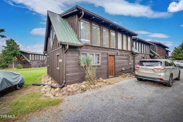 exterior space featuring a lawn and a garage