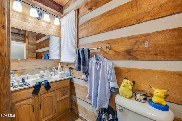 2390 W Allens Bridge Rd, Greeneville, TN 37743 - bathroom featuring toilet, wooden walls, and vanity