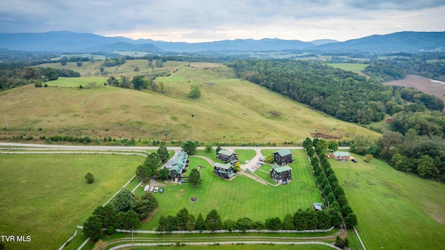 drone / aerial view with a mountain view and a rural view