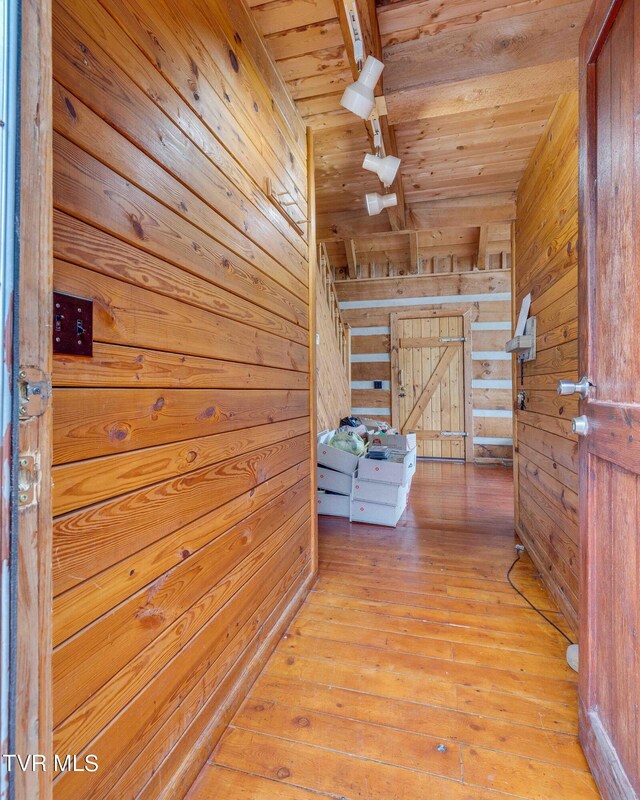 2390 W Allens Bridge Rd, Greeneville, TN 37743 - corridor with wood ceiling, wooden walls, light wood-style floors, and beam ceiling
