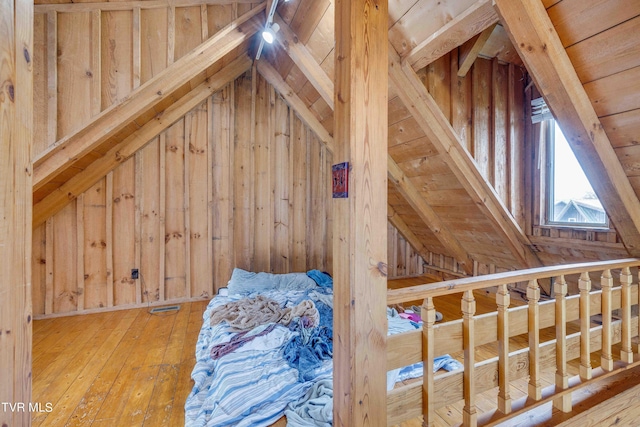 2390 W Allens Bridge Rd, Greeneville, TN 37743 - unfurnished bedroom with vaulted ceiling, hardwood / wood-style floors, and wooden walls