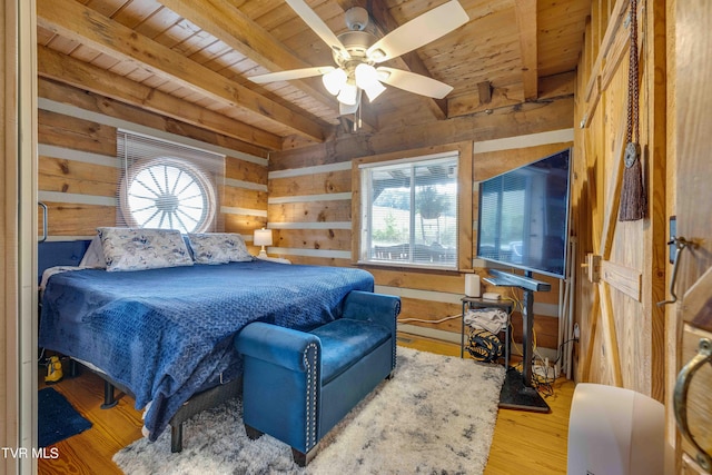 2390 W Allens Bridge Rd, Greeneville, TN 37743 - bedroom with wooden ceiling, wood walls, multiple windows, beamed ceiling, and wood finished floors