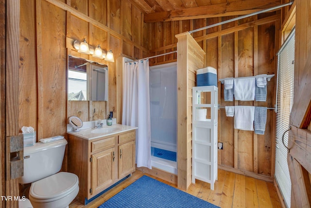 2390 W Allens Bridge Rd, Greeneville, TN 37743 - bathroom with wooden walls, a stall shower, toilet, hardwood / wood-style flooring, and vanity