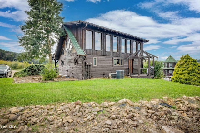 2390 W Allens Bridge Rd, Greeneville, TN 37743 - rear view of property with a lawn and central AC unit